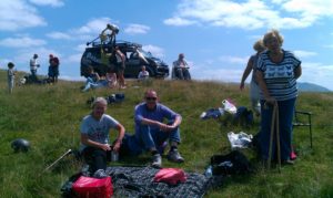 The group waiting on the hill side to fly