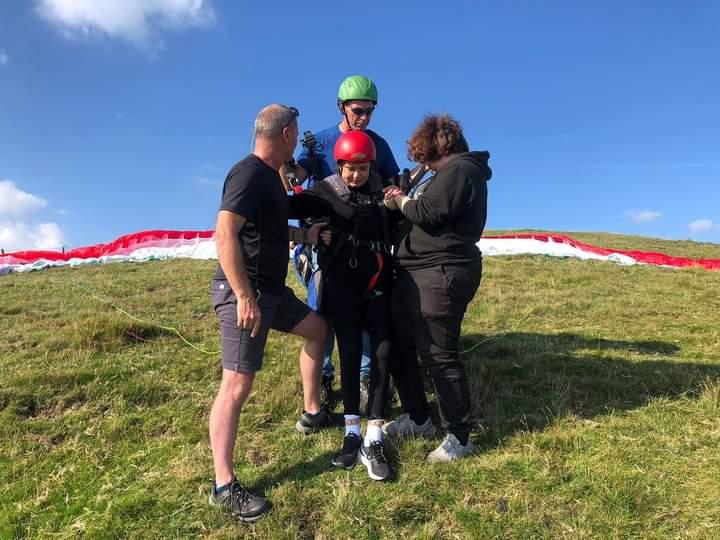 Sally andd yx paragliding clipping in to fly tandem
