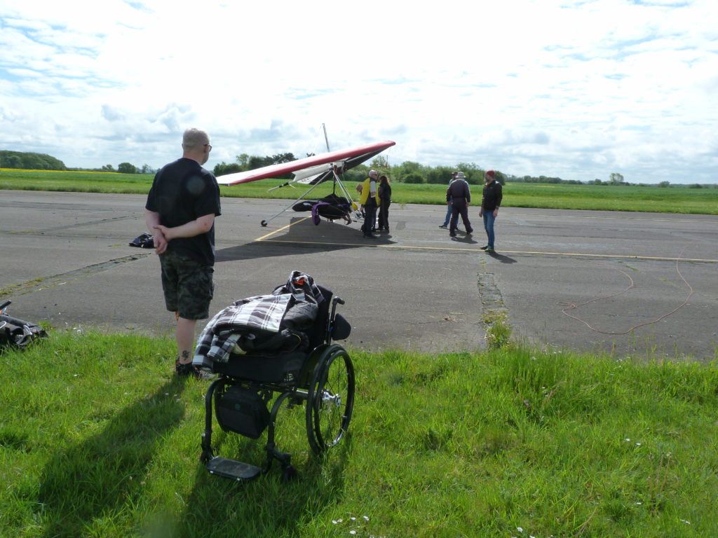 georges wheelchair empty as he gets ready to be towed up with Judy in the tandem hang glider at GBAR23