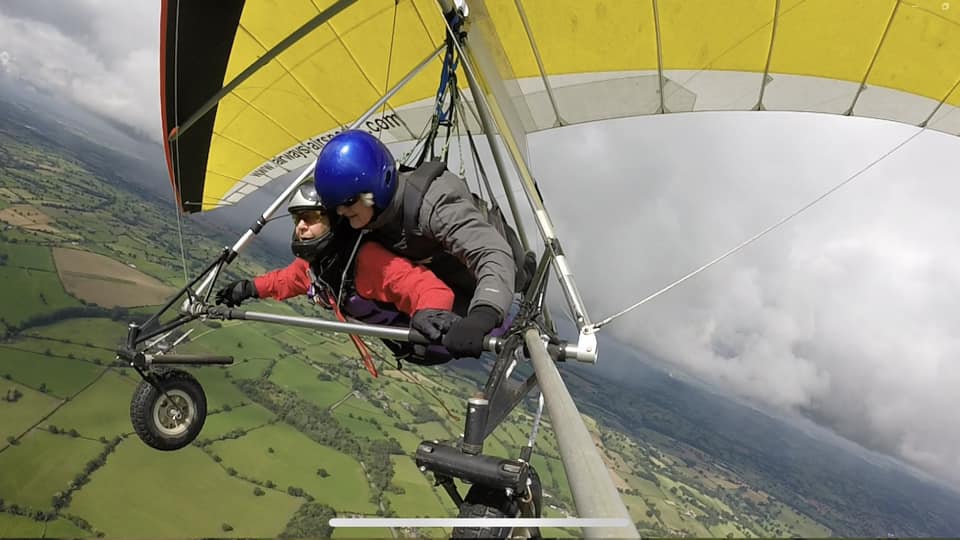 Sarah steering while flying Tandem hangglider with Judy